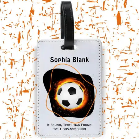 A product image of a luggage tag with the traveler's full name, if found text keyword and mobile phone number, printed with a soccer ball with flames and modern shapes in orange and black