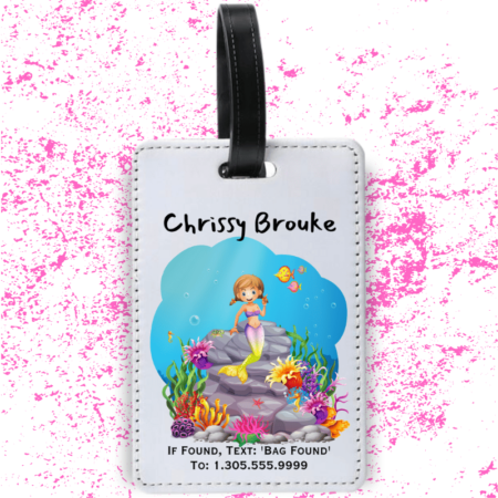 A product image of a luggage tag with the traveler's full name, if found text keyword and mobile phone number, printed with an underwater scene of a rocks, a cute mermaid, bold color corals, fish, starfish, and a seahorse