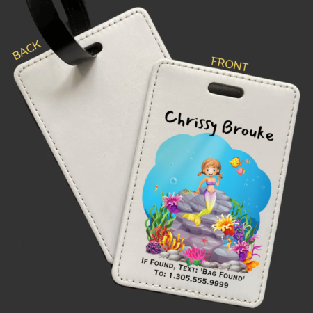 A product image of a luggage tag with the traveler's full name, if found text keyword and mobile phone number, printed with an underwater scene of a rocks, a cute mermaid, bold color corals, fish, starfish, and a seahorse