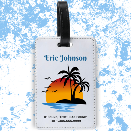 A product image of a luggage tag with the traveler's full name, if found text keyword and mobile phone number, printed with the a sun setting behind island palm trees, ocean water, and birds flying