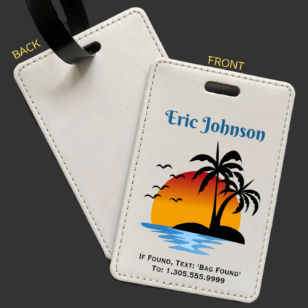 A product image of a luggage tag with the traveler's full name, if found text keyword and mobile phone number, printed with the a sun setting behind island palm trees, ocean water, and birds flying