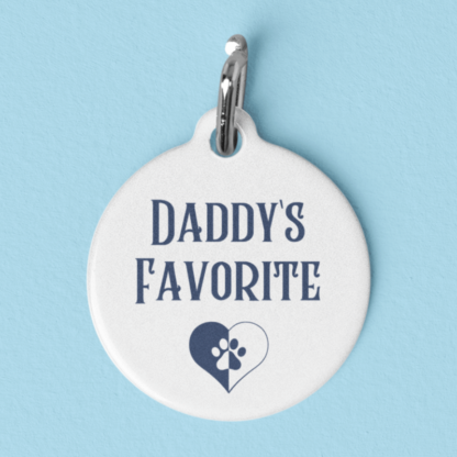 A product image of a pet ID tag with the words Daddy's favorite printed a heart with a heart paw print inside