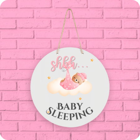 A product image of a baby sign with illustrated watercolor bear wrapped in a blanket, sleeping on a cloud and printed with the words Shhh... Baby Sleeping