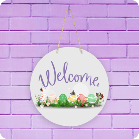 A product image of a welcome sign for spring with Easter eggs, butterflies, and a bunny printed in seasonal colors