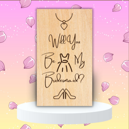 A product image of an laser engraved wedding attendee proposal card with a a necklace with a heart pendent, sleeveless dress, and high heel pumps. The card reads Will You Be My Bridesmaid?