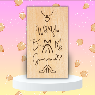 A product image of an laser engraved wedding attendee proposal card with a a necklace with a heart pendent, sleeveless dress, and high heel pumps. The card reads Will You Be My Groomsmaid?