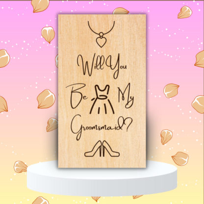 A product image of an laser engraved wedding attendee proposal card with a a necklace with a heart pendent, sleeveless dress, and high heel pumps. The card reads Will You Be My Groomsmaid?