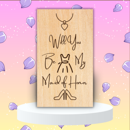 A product image of an laser engraved wedding attendee proposal card with a a necklace with a heart pendent, sleeveless dress, and high heel pumps. The card reads Will You Be My Maid of Honor?