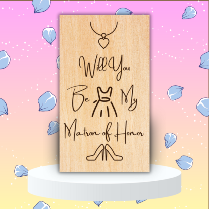 A product image of an laser engraved wedding attendee proposal card with a a necklace with a heart pendent, sleeveless dress, and high heel pumps. The card reads Will You Be My Matron of Honor?