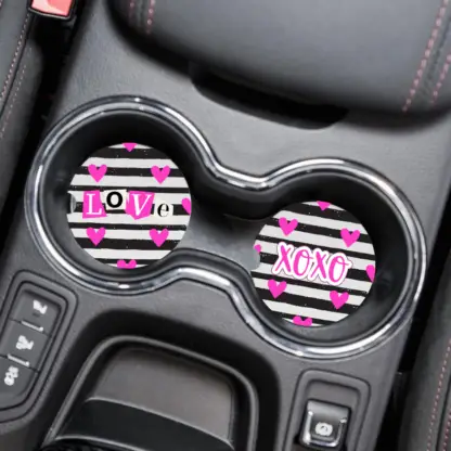 Product image of love and xoxo car coasters that are striped with hot pink hearts