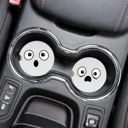 Product image of a set of car coasters with silly faces