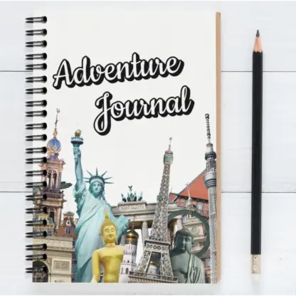 Product image of an adventure journal notebook, along side a pencil