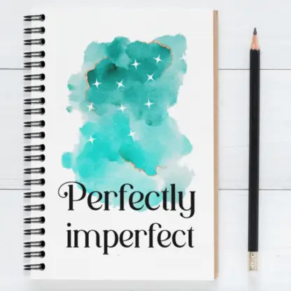 Product image of an motivational journal notebook, along side a pencil