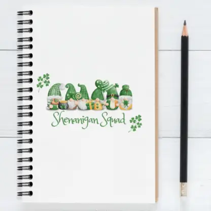 A product image of a wire ring notebook with St Patrick's Day themed gnomes, shamrocks, and the words "Shenanigan Squad"