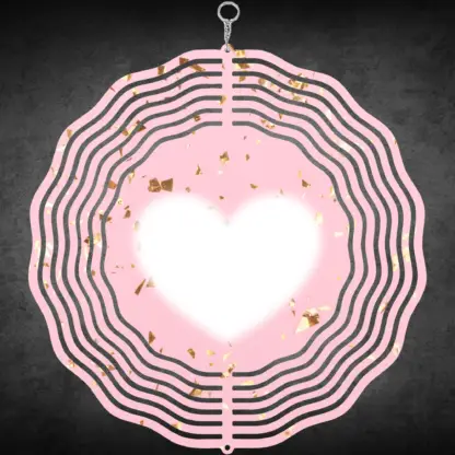 A product image of a 3D wind spinner with powder pink background with gold confetti and the beating heart.