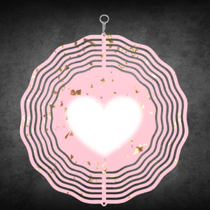 A product image of a 3D wind spinner with powder pink background with gold confetti and the beating heart.