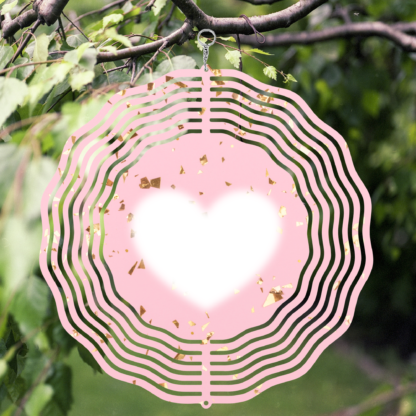 A product image of a 3D wind spinner with powder pink background with gold confetti and the beating heart.