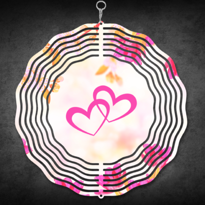 A product image of a 3D wind spinner with flower background. One side has a person's hand and a dog's paw with the words Partners in Crime. The second side has 2 hearts