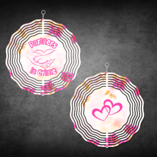 A product image of a 3D wind spinner with flower background. One side has a person's hand and a dog's paw with the words Partners in Crime. The second side has 2 hearts